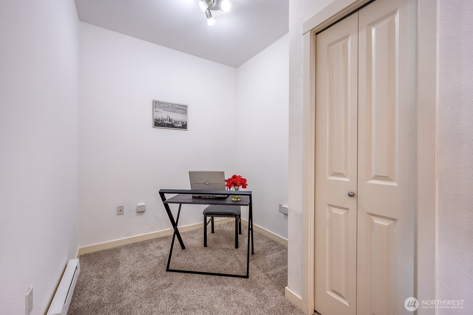 16141 Cleveland Street, Unit 412 Redmond, WA 98052 - Photo 27 of 31 a room that has a table and chair in it