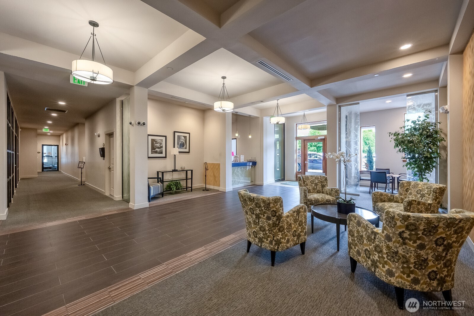 16141 Cleveland Street, Unit 412 Redmond, WA 98052 - Photo 3 of 31 a living room with furniture and a chandelier