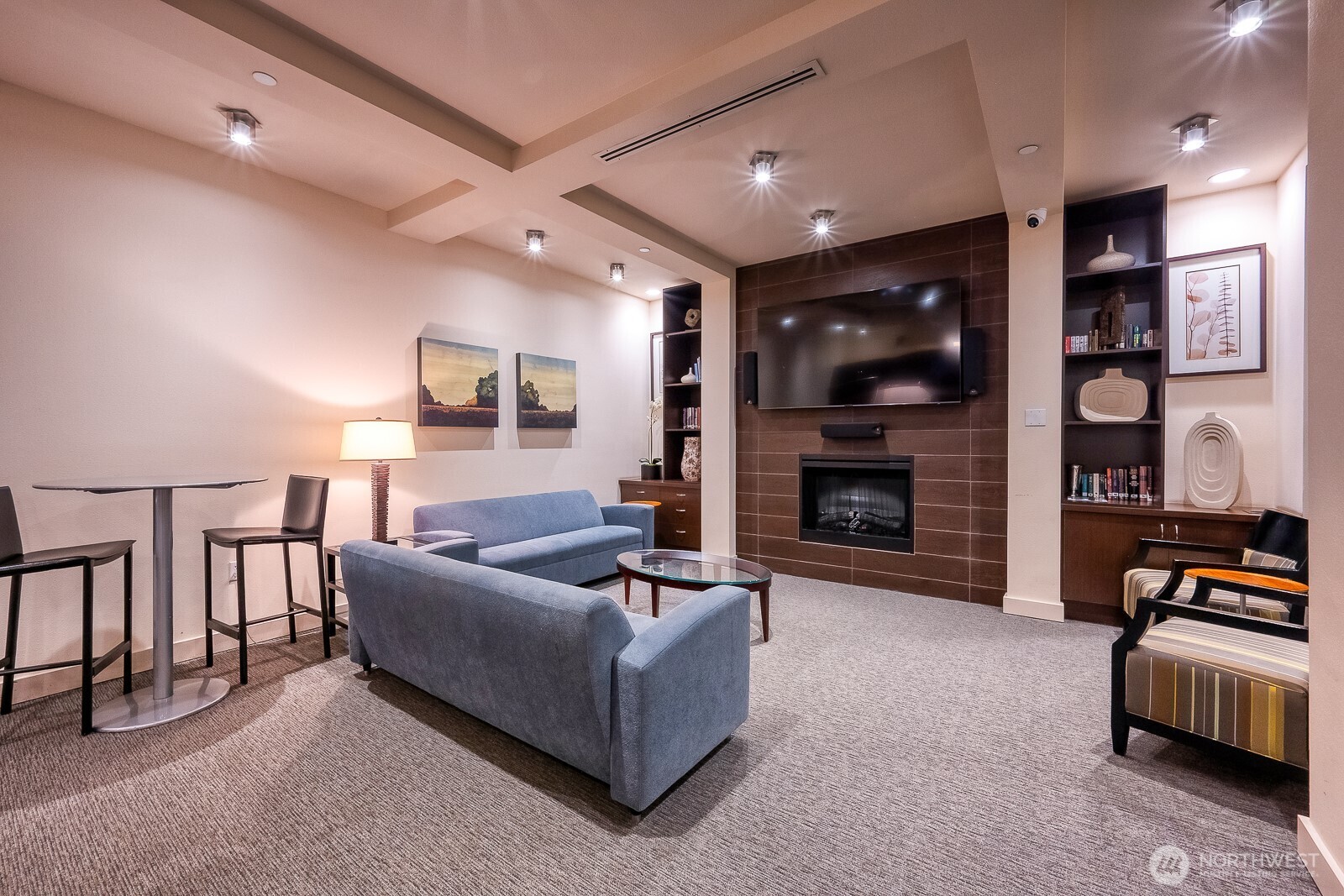 16141 Cleveland Street, Unit 412 Redmond, WA 98052 - Photo 6 of 31 a living room with furniture and a fireplace