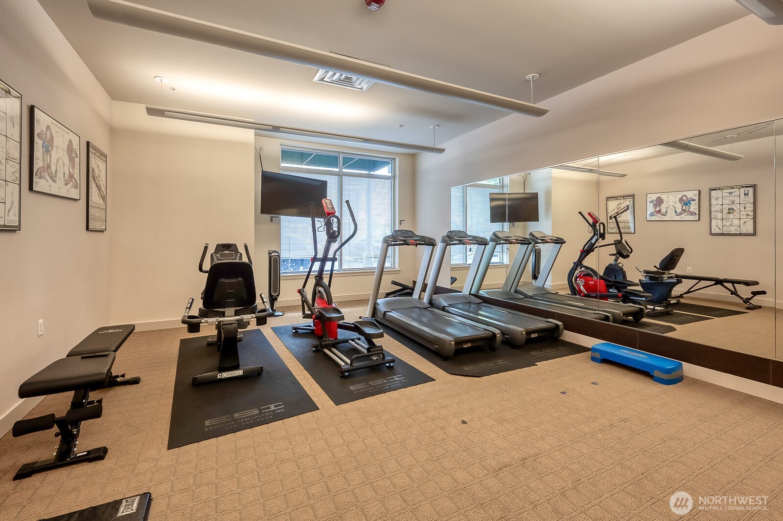 16141 Cleveland Street, Unit 412 Redmond, WA 98052 - Photo 7 of 31 a view of a room with gym equipment