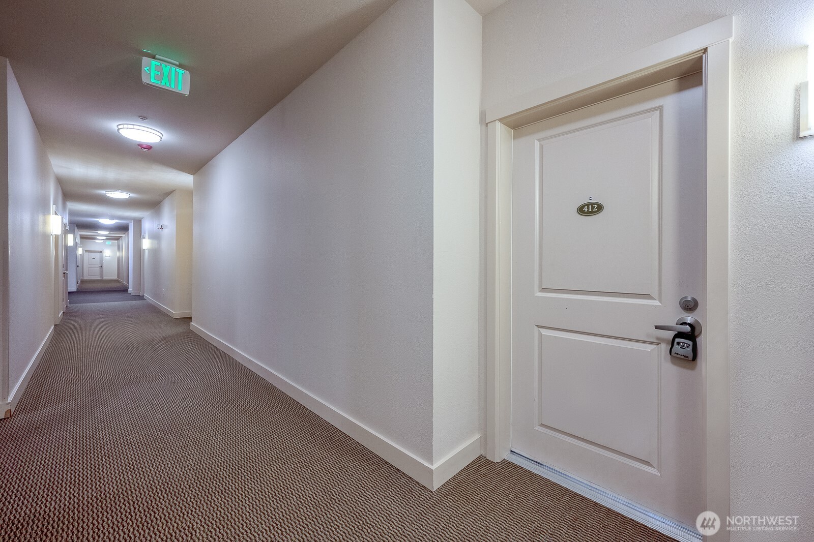 16141 Cleveland Street, Unit 412 Redmond, WA 98052 - Photo 8 of 31 a view of a hallway with closet and a bathroom