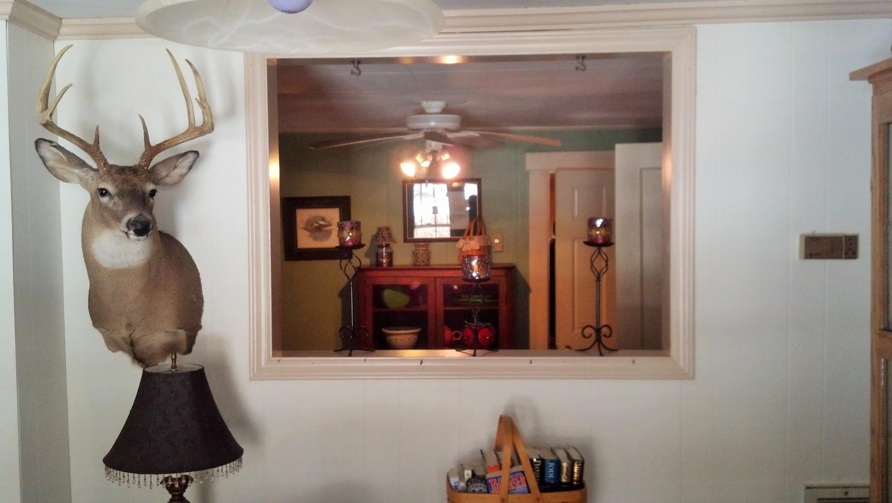 886 Custers Ridge Road Boones Mill, VA 24065 - Photo 11 of 11 a view of hallway with furniture and chandelier