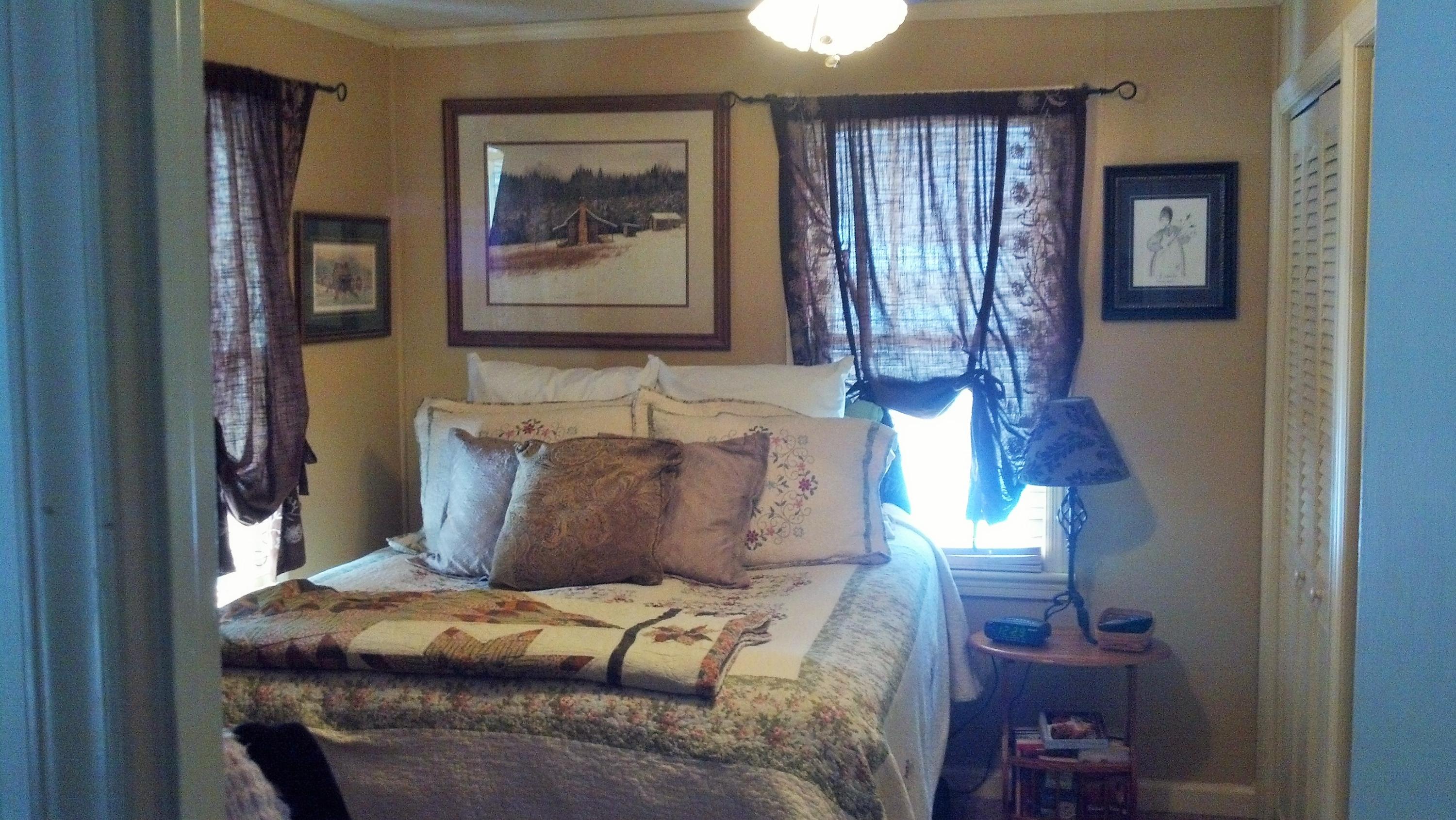 886 Custers Ridge Road Boones Mill, VA 24065 - Photo 8 of 11 a bedroom with a bed and a painting on the wall