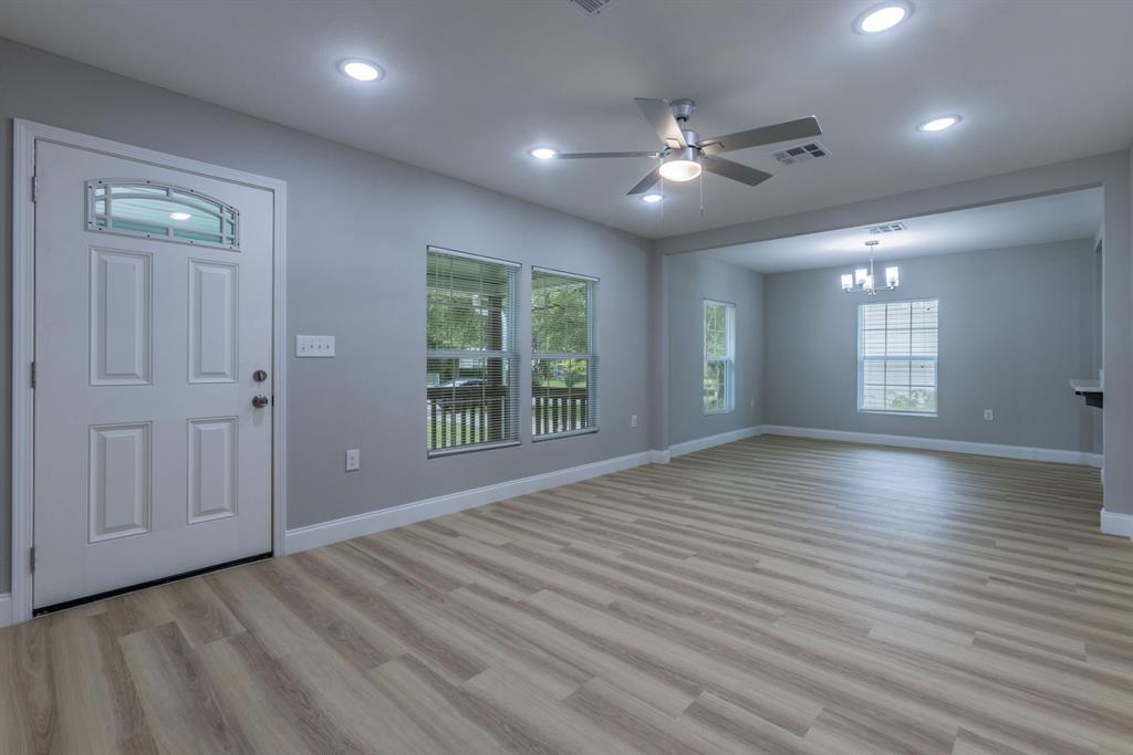 2816 Summer Avenue Waco, TX 76708 - Photo 2 of 16 a view of an empty room with window and wooden floor