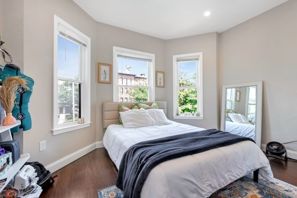 777 Columbia Road, Unit 2 Boston, MA 02125 - Photo 11 of 21 a bedroom with a bed and a window