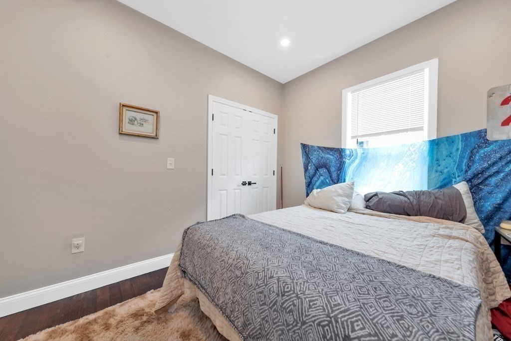 777 Columbia Road, Unit 2 Boston, MA 02125 - Photo 12 of 21 a bedroom with a bed and a window