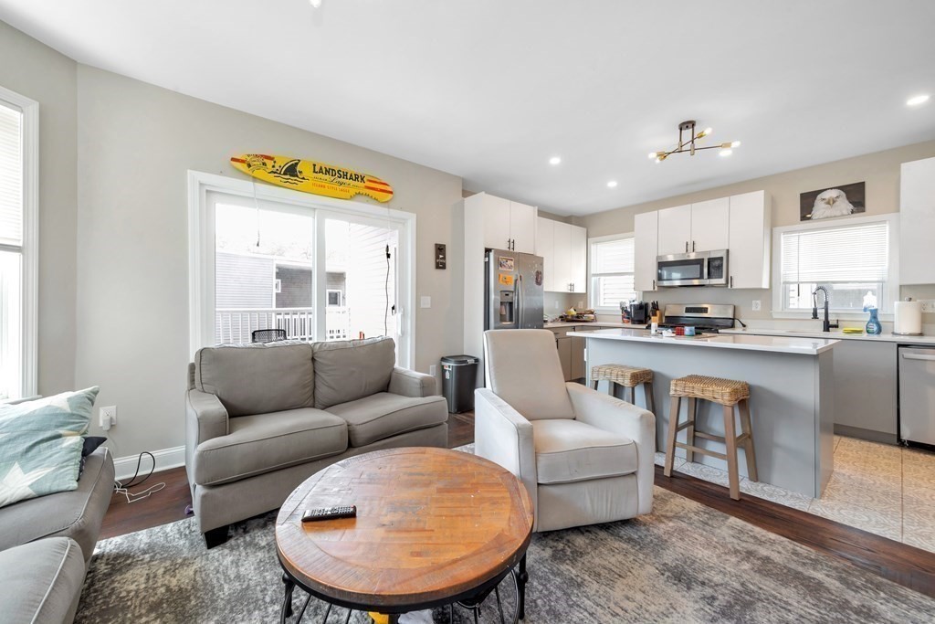 777 Columbia Road, Unit 2 Boston, MA 02125 - Photo 18 of 21 a living room with furniture and a large window
