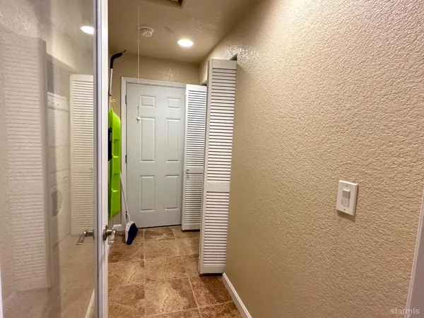 a view of a bathroom with a shower and a sink
