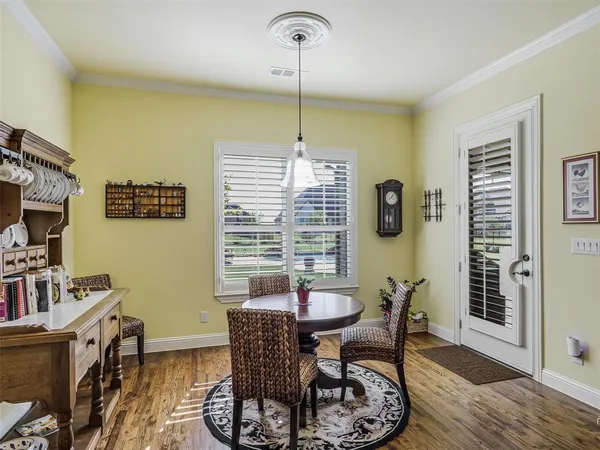 a kitchen with sink cabinets and living room view