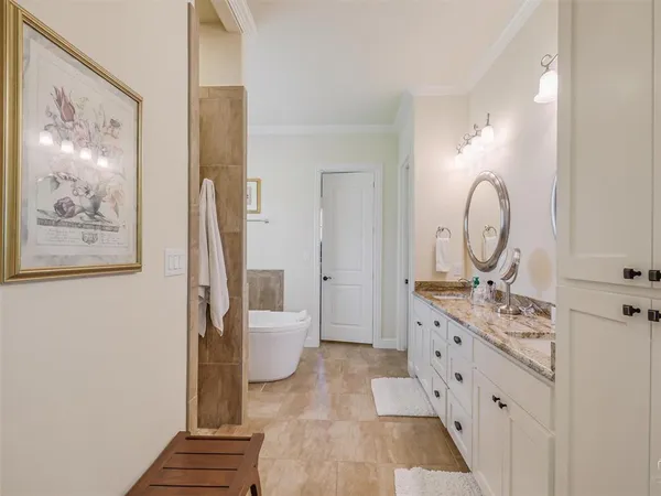 a view of a hallway with bathroom