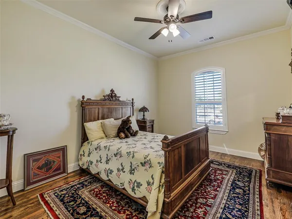 a bed room with a bed and a chandelier
