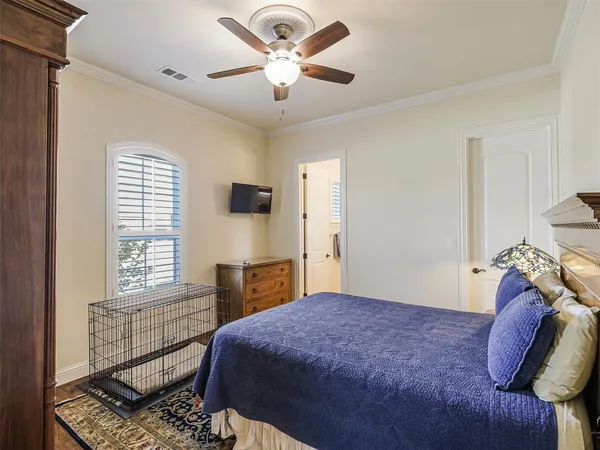 a bedroom with a bed dresser and a window