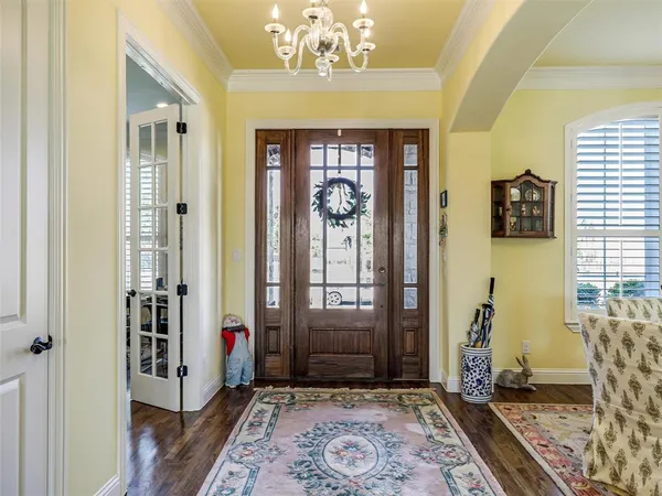 a view of an entryway with a chandelier