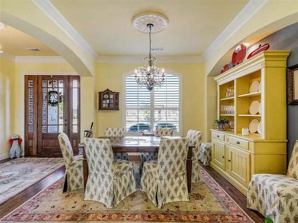 a view of a dining room with furniture and window