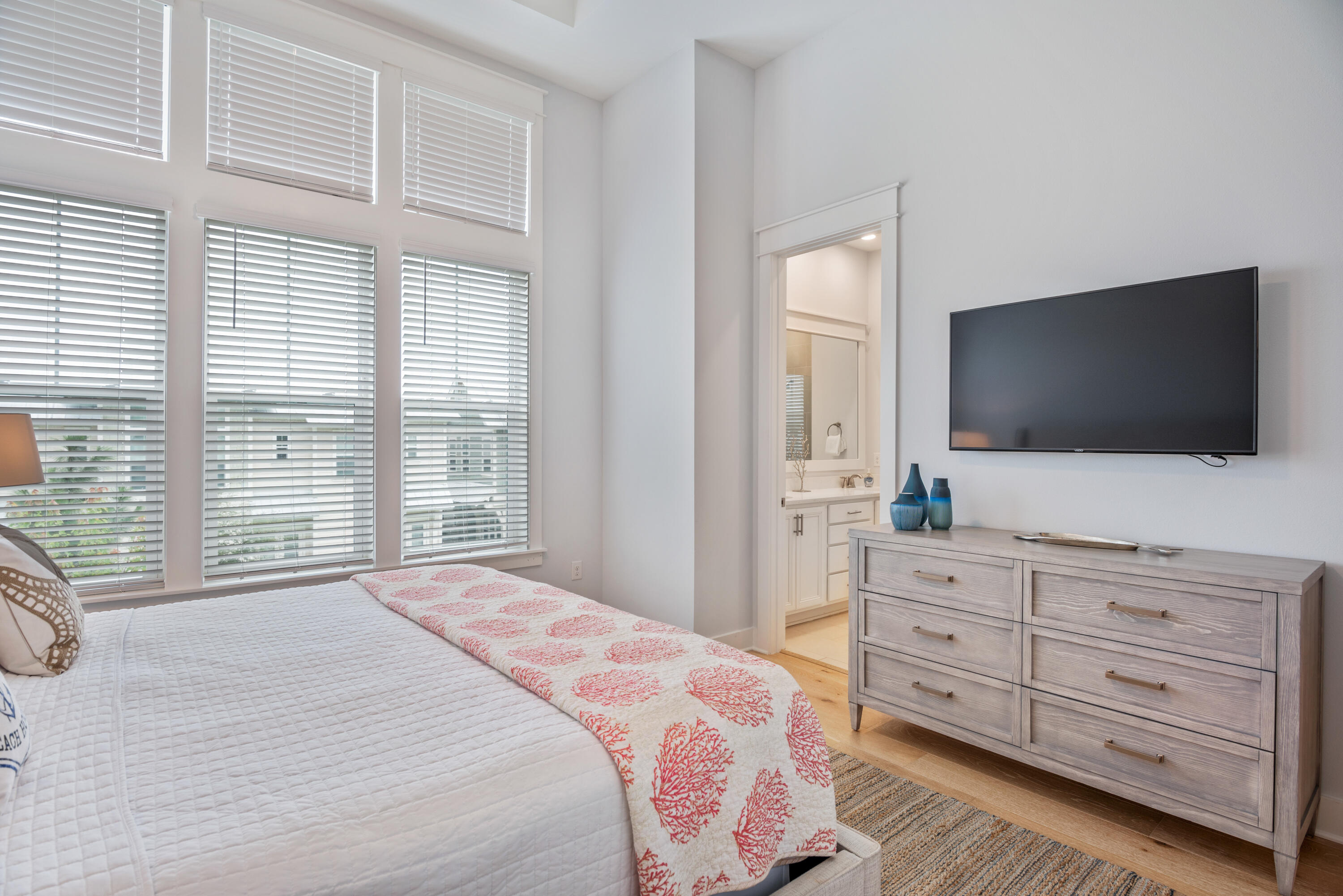 296 Milestone Dr Inlet Beach, Unit B Inlet Beach, FL 32461 - Photo 13 of 47 a bedroom with a bed and a flat screen tv