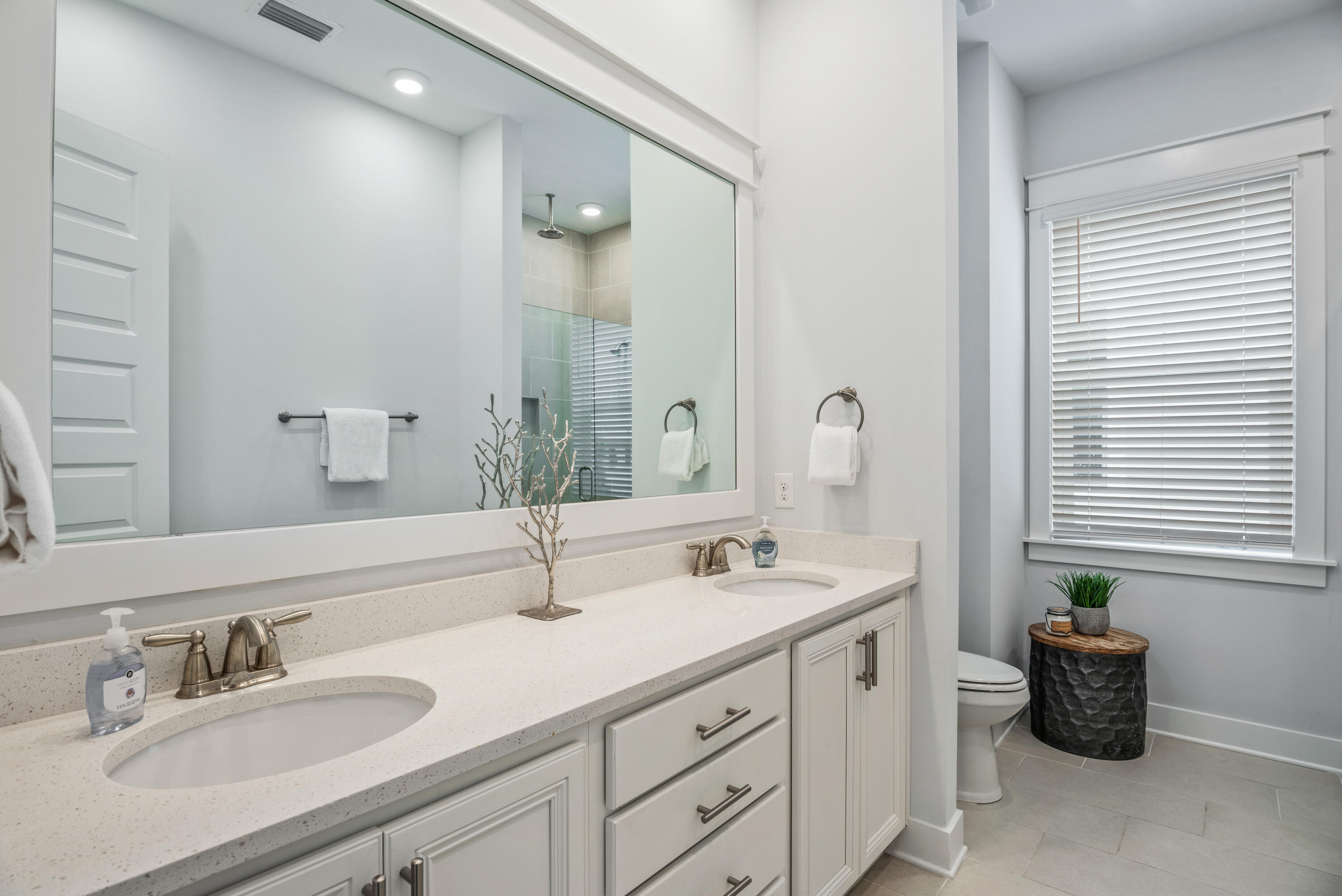 296 Milestone Dr Inlet Beach, Unit B Inlet Beach, FL 32461 - Photo 14 of 47 a bathroom with double sink and a mirror