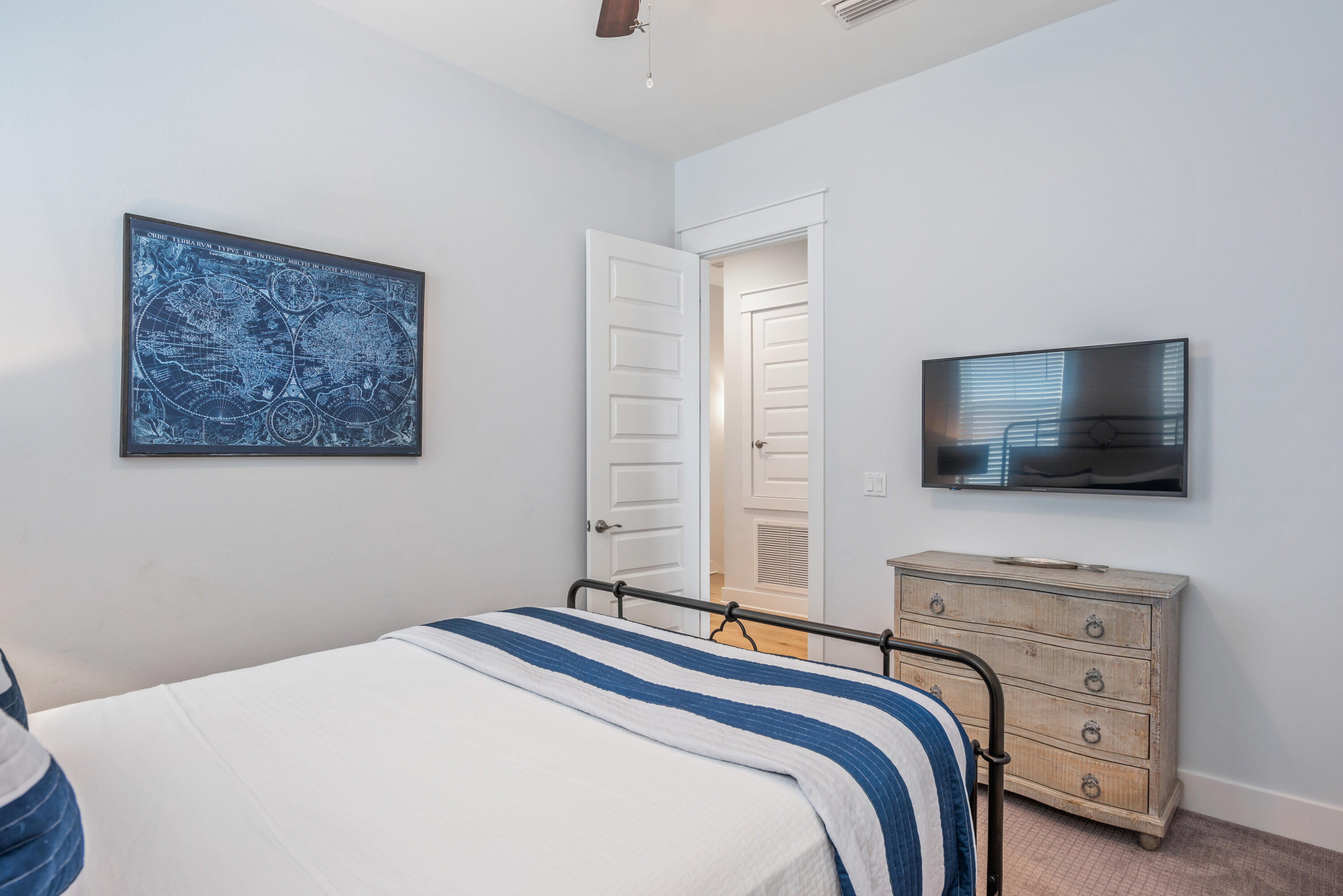 296 Milestone Dr Inlet Beach, Unit B Inlet Beach, FL 32461 - Photo 17 of 47 a bedroom with a bed and a flat screen tv