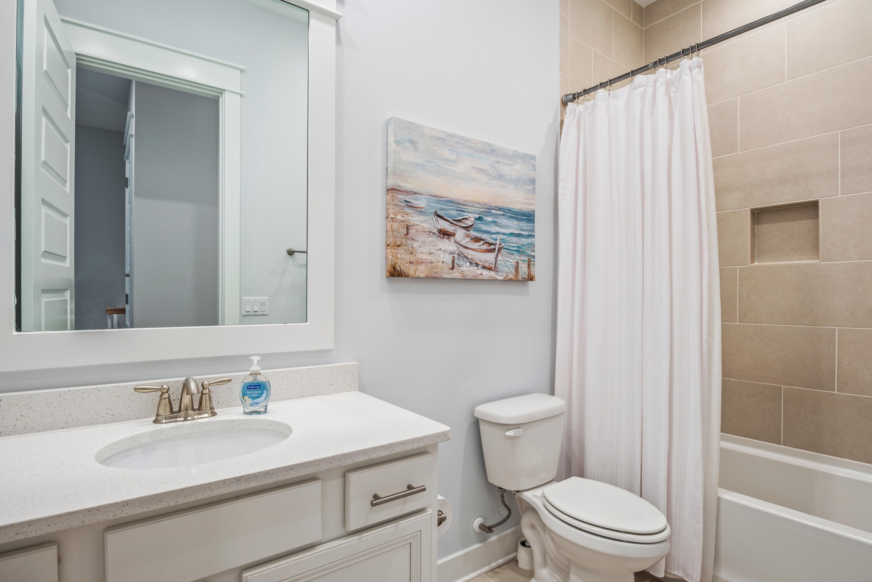 296 Milestone Dr Inlet Beach, Unit B Inlet Beach, FL 32461 - Photo 20 of 47 a bathroom with a sink a toilet and shower curtain
