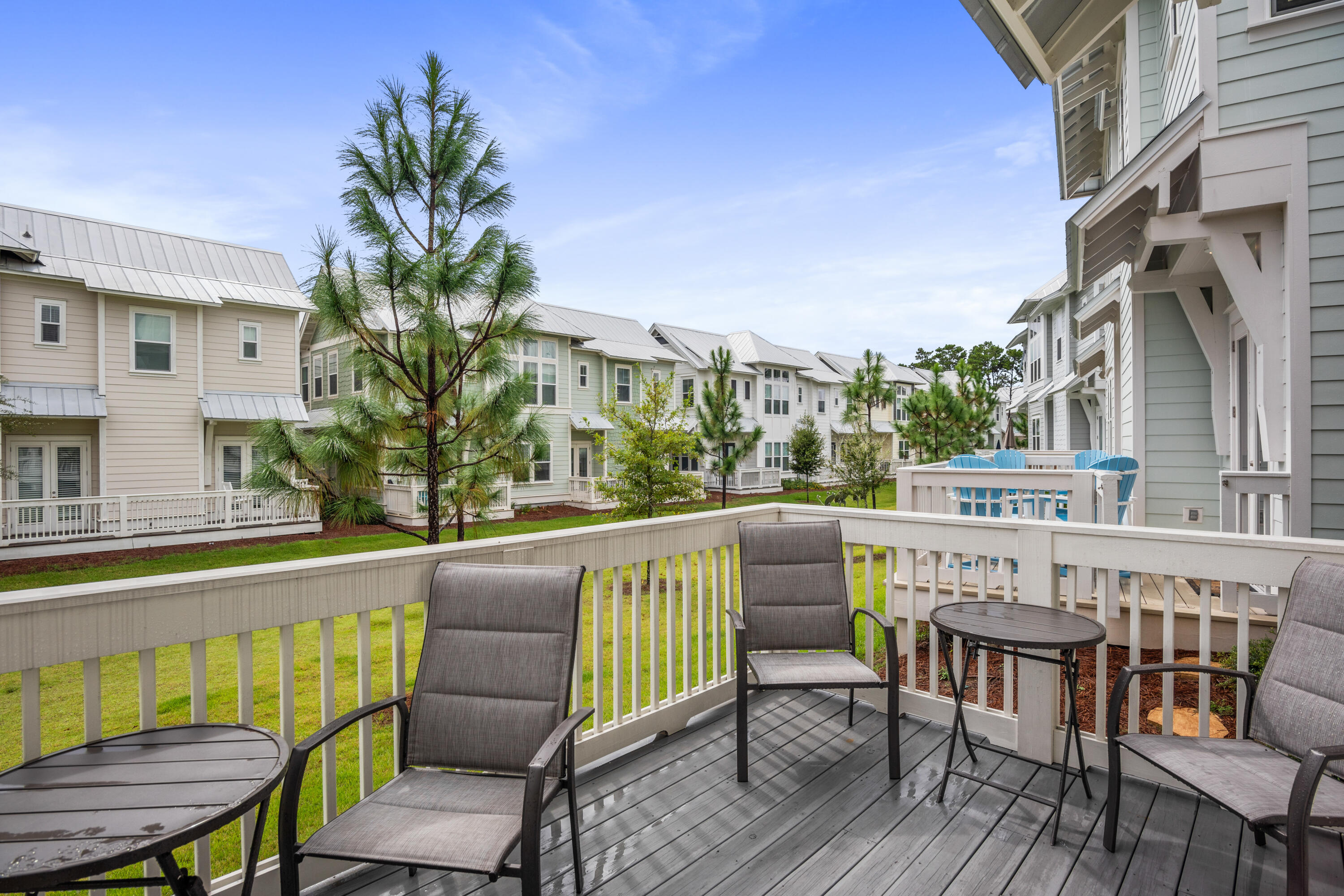 296 Milestone Dr Inlet Beach, Unit B Inlet Beach, FL 32461 - Photo 24 of 47 a view of a chair and table on the deck
