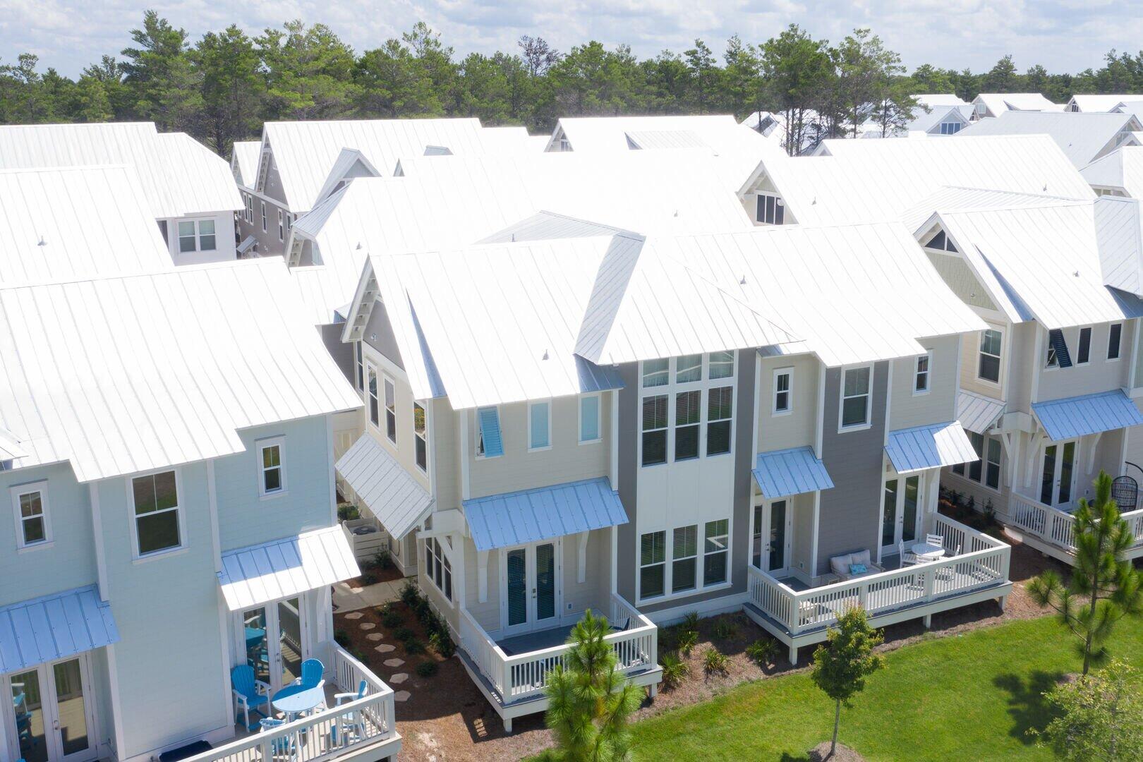 296 Milestone Dr Inlet Beach, Unit B Inlet Beach, FL 32461 - Photo 27 of 47 a view of a building with a outdoor space
