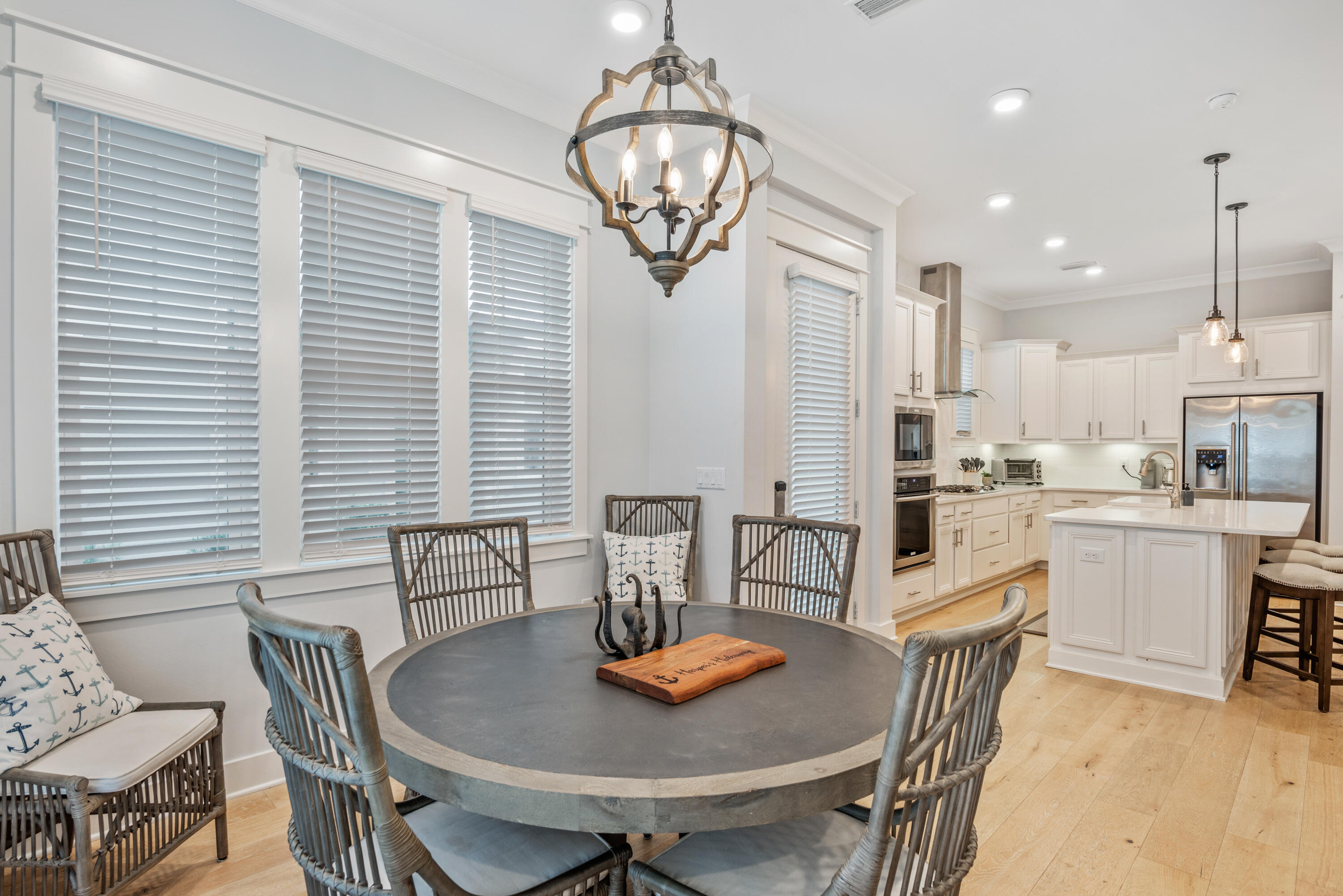 296 Milestone Dr Inlet Beach, Unit B Inlet Beach, FL 32461 - Photo 4 of 47 a view of a dining room with furniture and chandelier