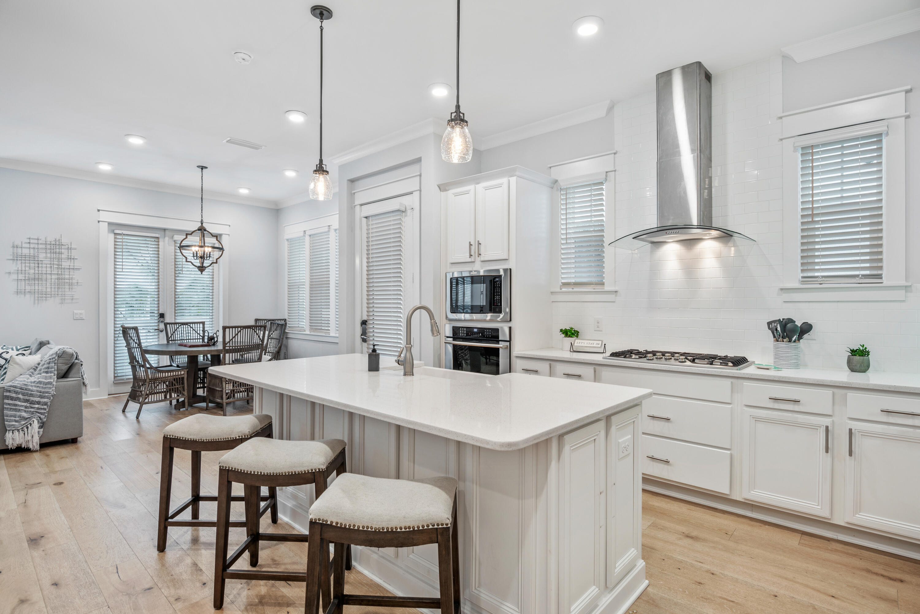 296 Milestone Dr Inlet Beach, Unit B Inlet Beach, FL 32461 - Photo 7 of 47 a large kitchen with a table and chairs