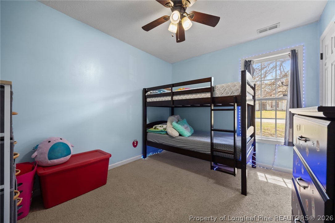 236 Proclamation Drive Raeford, NC 28376 - Photo 13 of 43 a bedroom with furniture and a fan