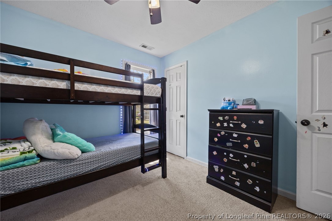 236 Proclamation Drive Raeford, NC 28376 - Photo 14 of 43 a bedroom with a bed closet and window