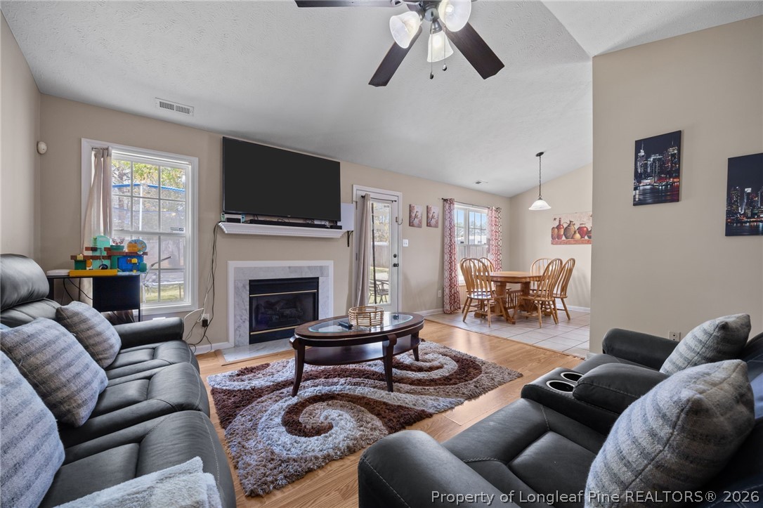 236 Proclamation Drive Raeford, NC 28376 - Photo 16 of 43 a living room with furniture fireplace and window