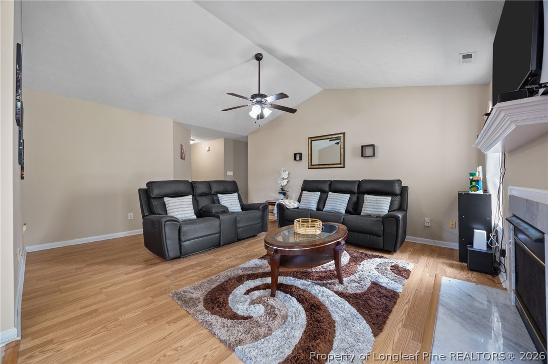 236 Proclamation Drive Raeford, NC 28376 - Photo 19 of 43 a living room with furniture and a flat screen tv