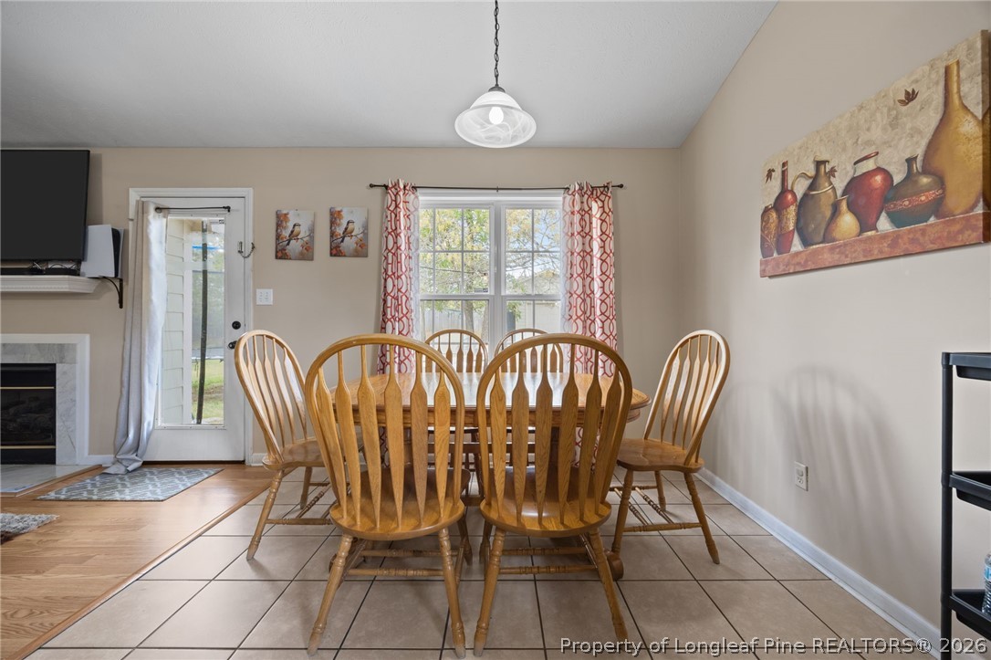 236 Proclamation Drive Raeford, NC 28376 - Photo 23 of 43 a view of a dining room with furniture window and wooden floor