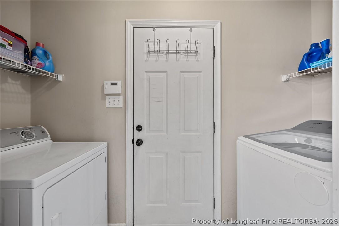 236 Proclamation Drive Raeford, NC 28376 - Photo 30 of 43 a utility room with dryer and washer