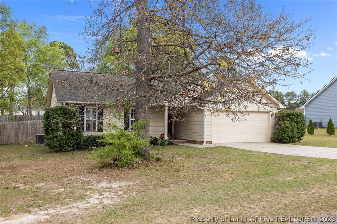 236 Proclamation Drive Raeford, NC 28376 - Photo 3 of 43 a view of a house with a tree and a yard