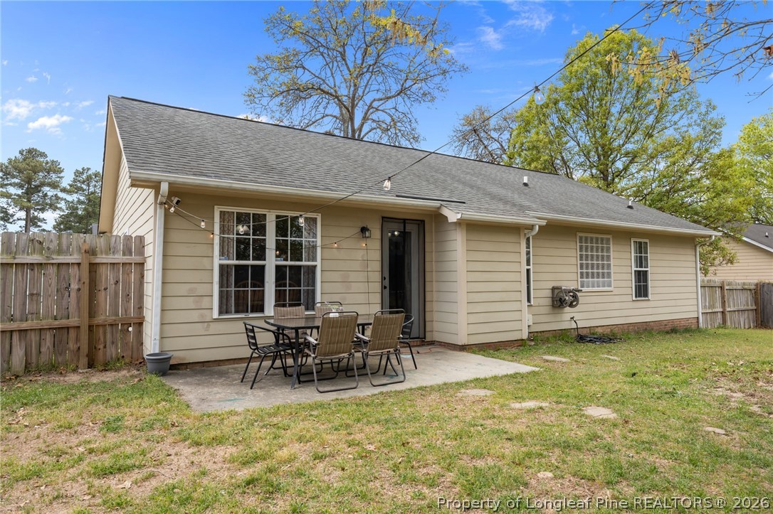 236 Proclamation Drive Raeford, NC 28376 - Photo 34 of 43 a view of a house with a patio and a yard
