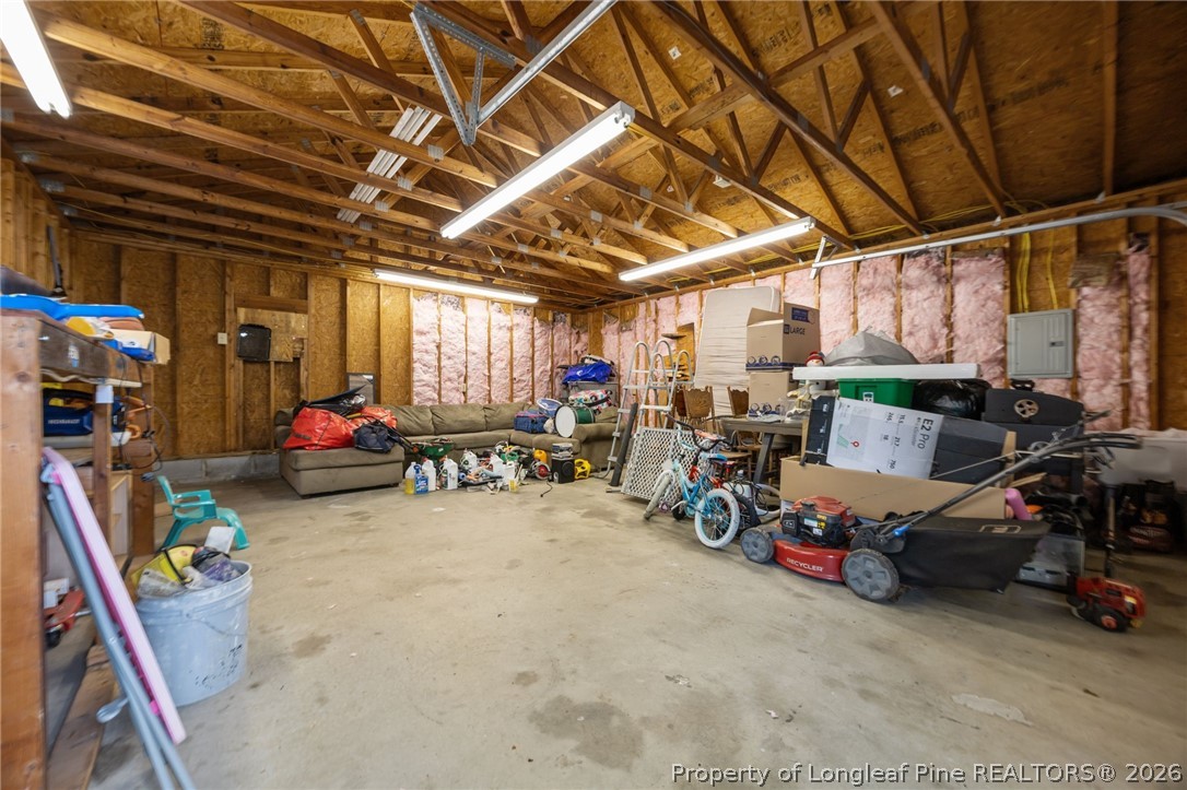 236 Proclamation Drive Raeford, NC 28376 - Photo 38 of 43 a view of a garage with a bike and a car