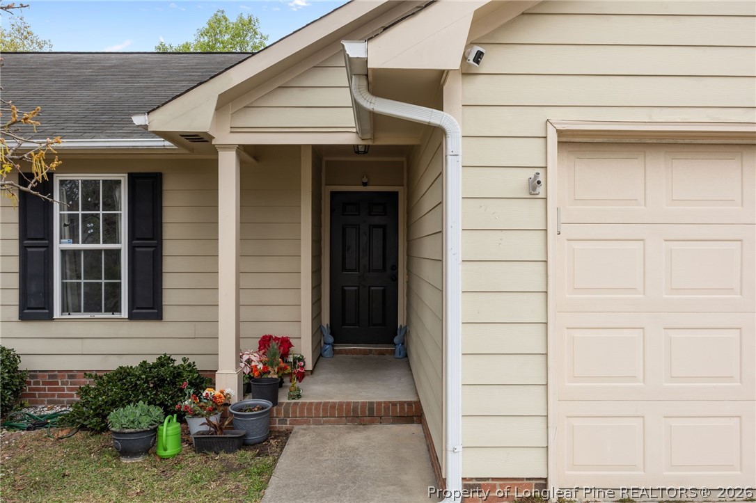 236 Proclamation Drive Raeford, NC 28376 - Photo 40 of 43 a view of a house with potted plants