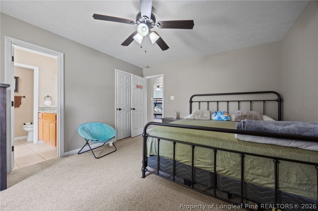 236 Proclamation Drive Raeford, NC 28376 - Photo 8 of 43 a bedroom with furniture and a chandelier