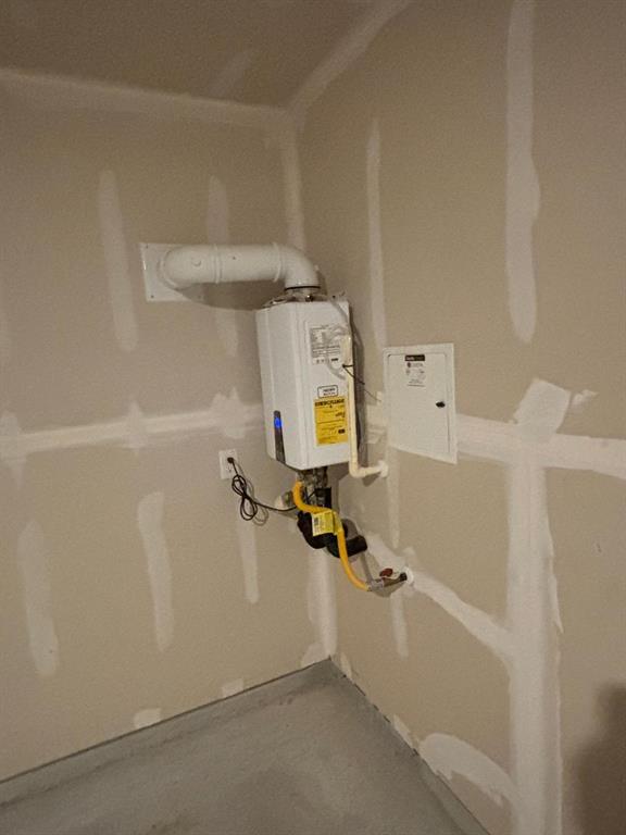 9204 Schram Road Fort Worth, TX 76179 - Photo 13 of 17 Tankless water heater installation showcasing a clean, compact design