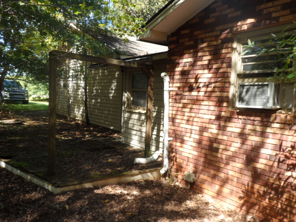 165 State Rd S-39-279 Central, SC 29630 - Photo 6 of 19 Mature trees shade the brick and siding exterior of this home.