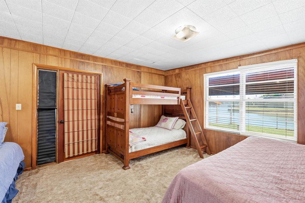 4513 Chapel Road Graham, TX 76450 - Photo 14 of 38 a bedroom with a bed and a window