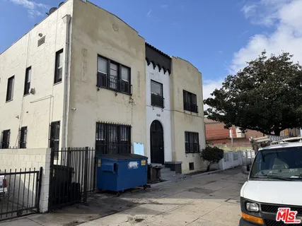 a view of a house with a barbeque area