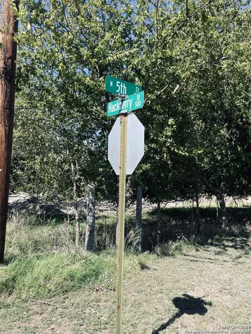 a table and chairs in a yard