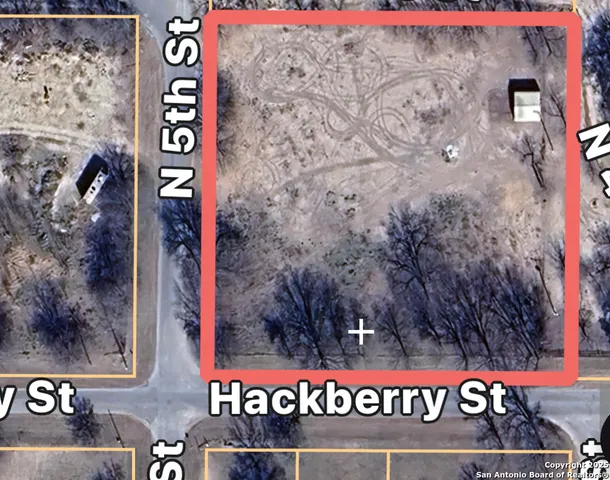 a street sign that is on a brick wall