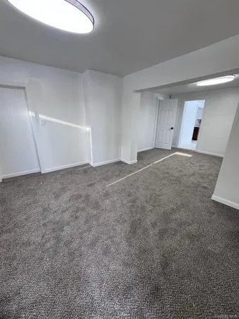 an empty room with a natural light