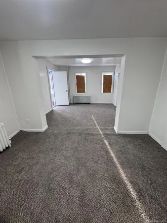 a kitchen with stainless steel appliances granite countertop a sink a microwave a refrigerator and a stove