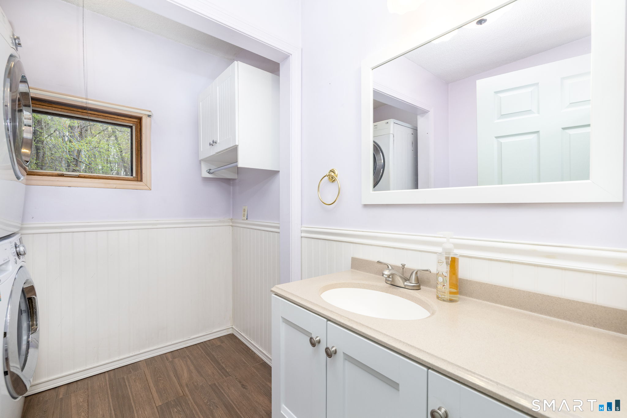 36 Sage Way Torrington, CT 06790 - Photo 12 of 40 1st floor half bathroom includes a convenient stackable washer/dryer unit.