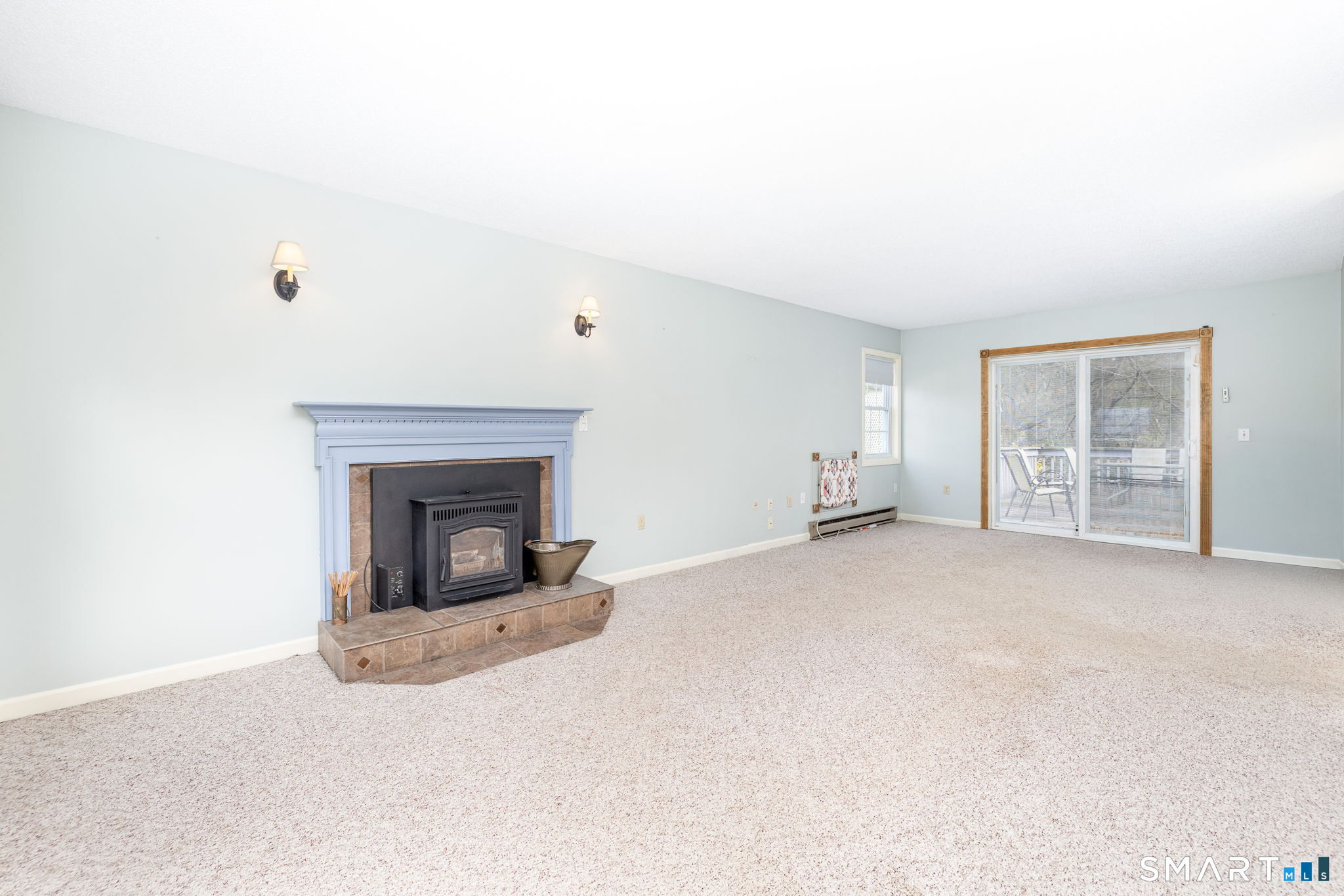 36 Sage Way Torrington, CT 06790 - Photo 3 of 40 Fireplace features a pellet stove insert.