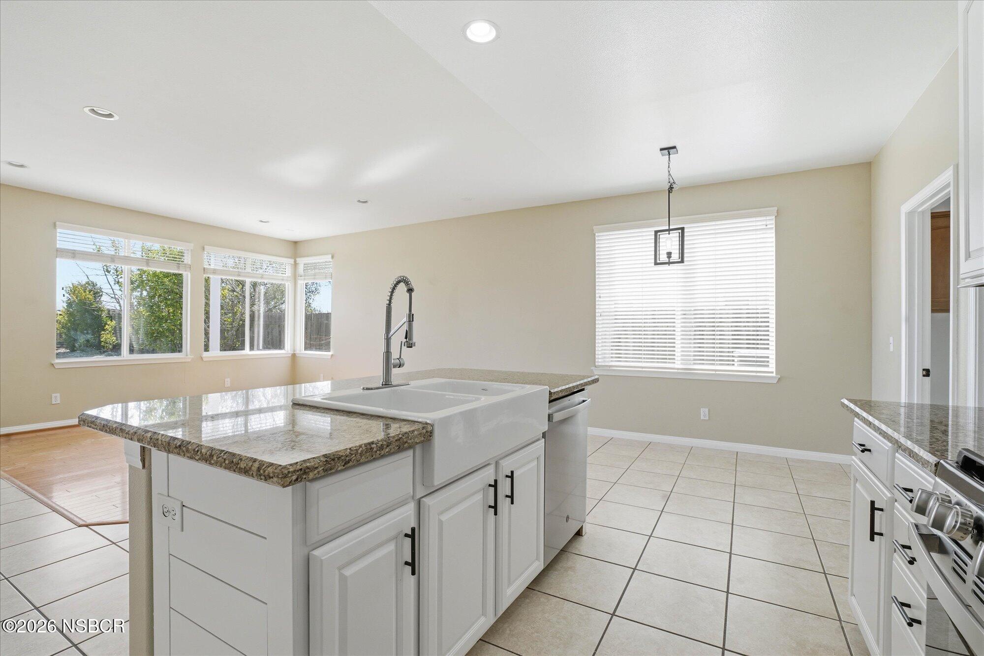 280 Rinconcito Lompoc, CA 93436 - Photo 12 of 39 a kitchen with granite countertop a sink and a window