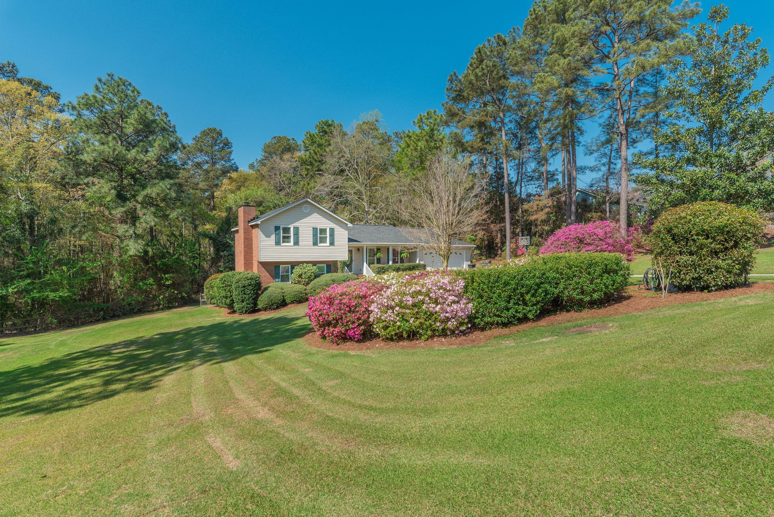 1117 Ridgemont Drive Aiken, SC 29803 - Photo 1 of 49 a front view of a house with garden