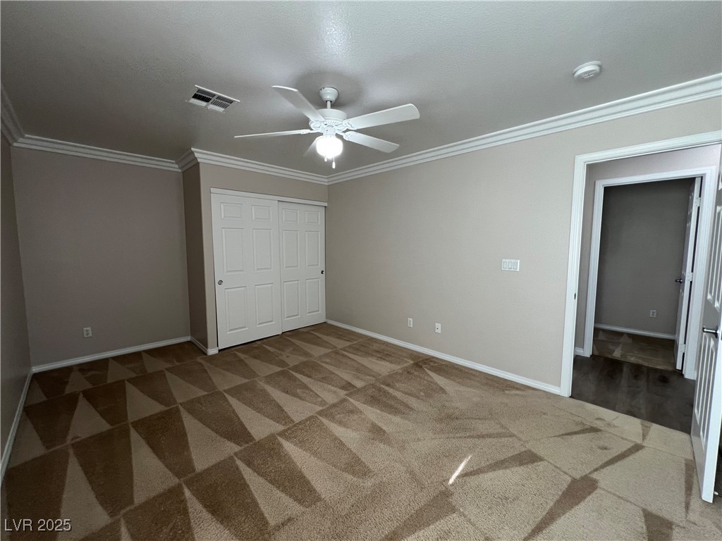 7195 Cestrum Road Las Vegas, NV 89113 - Photo 11 of 33 Unfurnished bedroom with carpet, baseboards, ornam